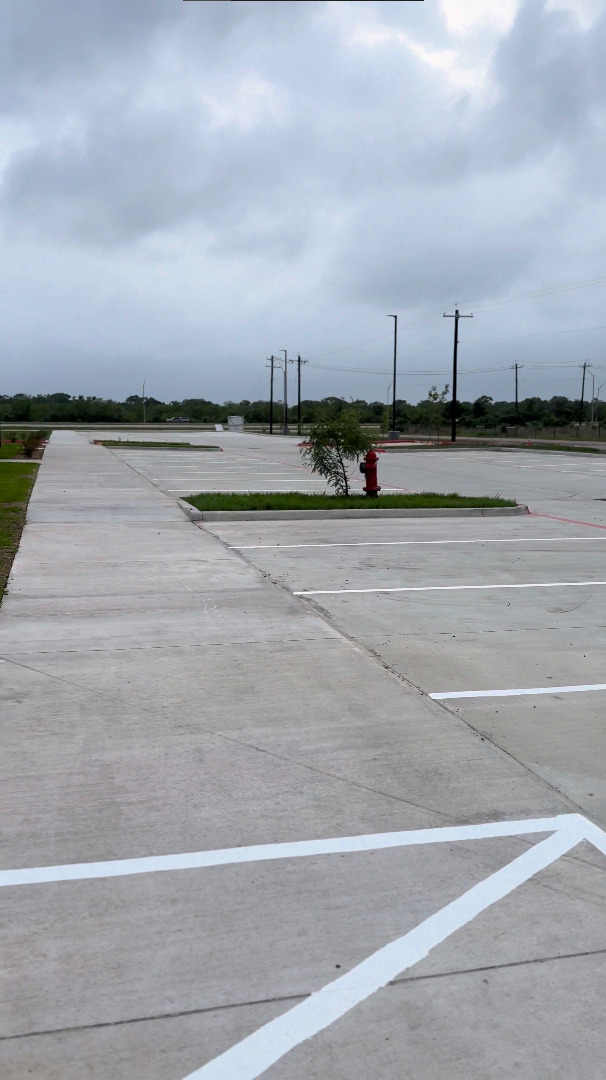 Crew member painting a crosswalk